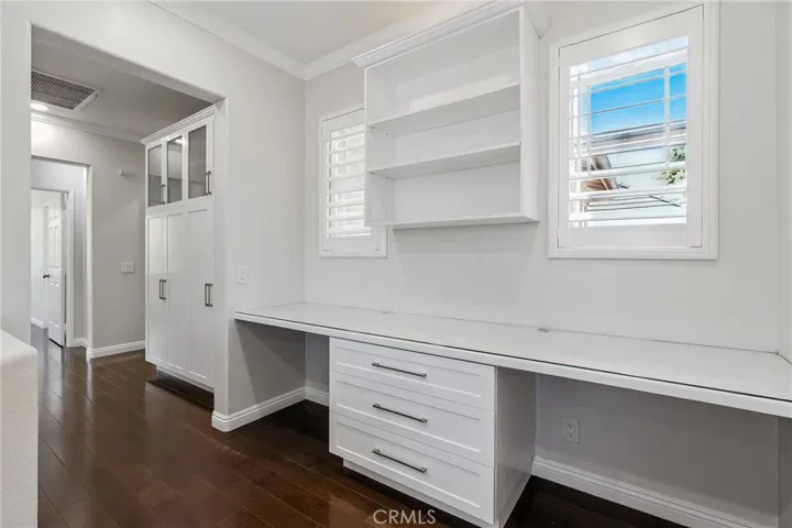 Upstairs dual desk space and storage. An added bonus of functioning windows for a wonderful  breeze.