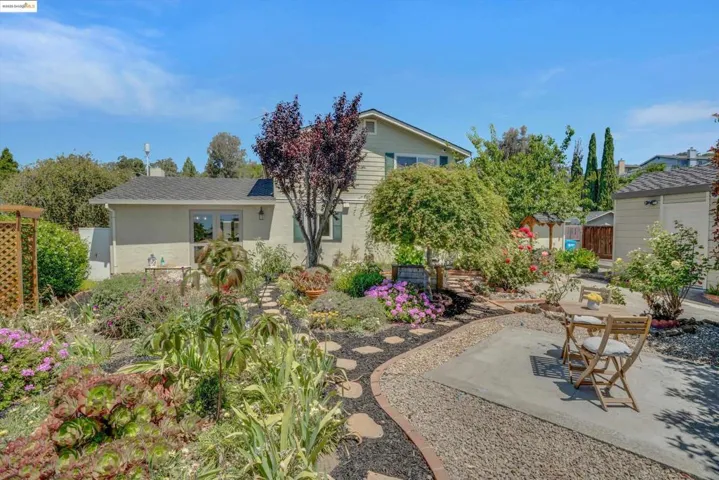 Rear view of property featuring a patio and stucco siding