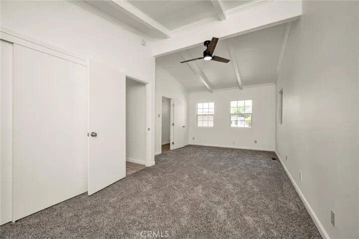 primary bedroom with half bathroom