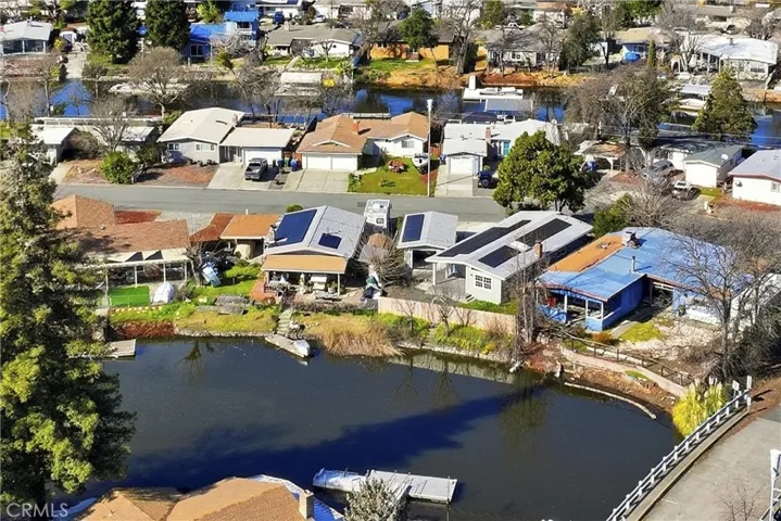 showing back of home and detached garage