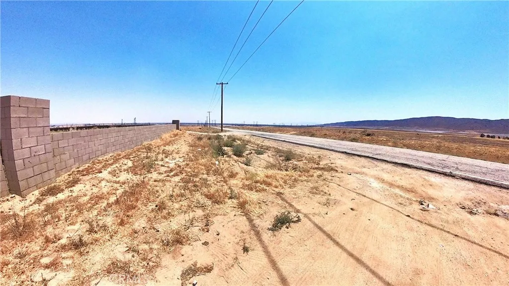Paved road in front of the lot