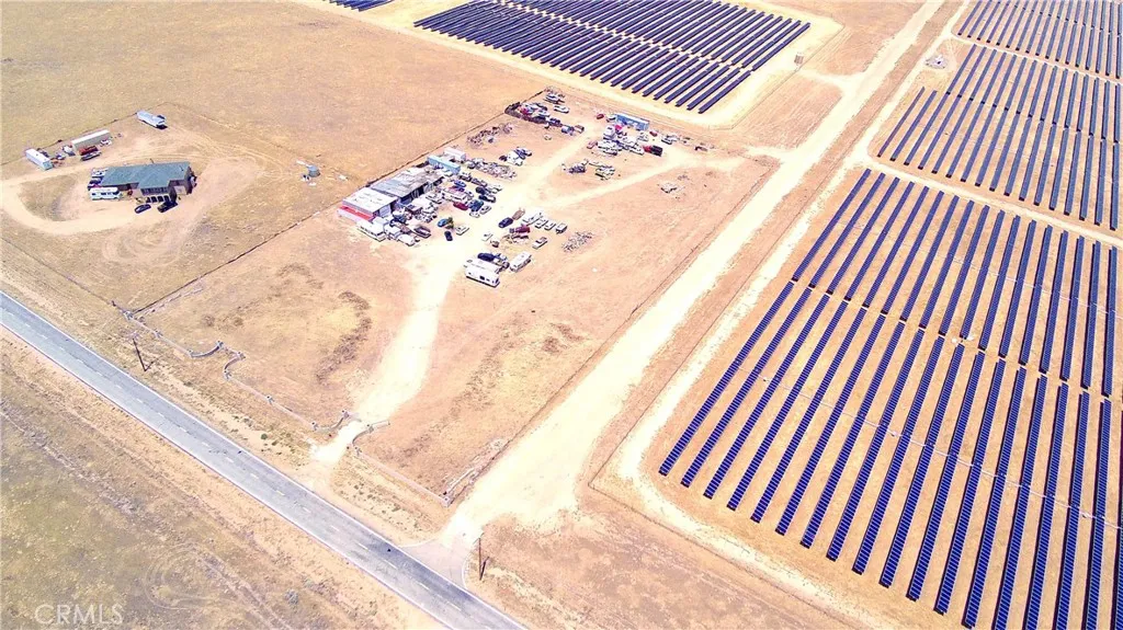 Property lot surrounding with neighbor and solar panels and front of road