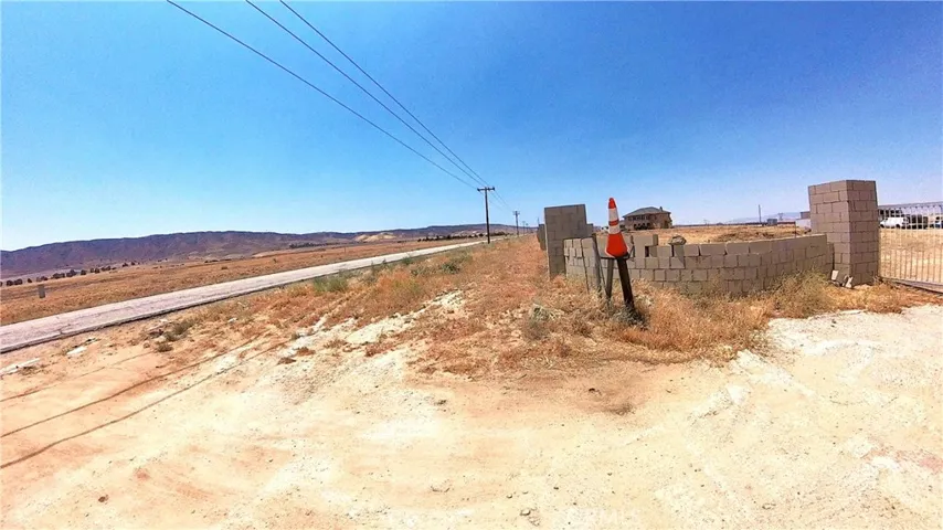 Paved road in front of the lot