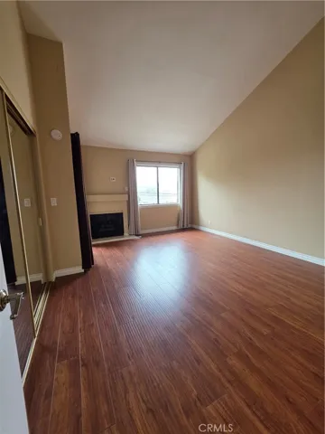 Primary Bedroom with fireplace and balcony