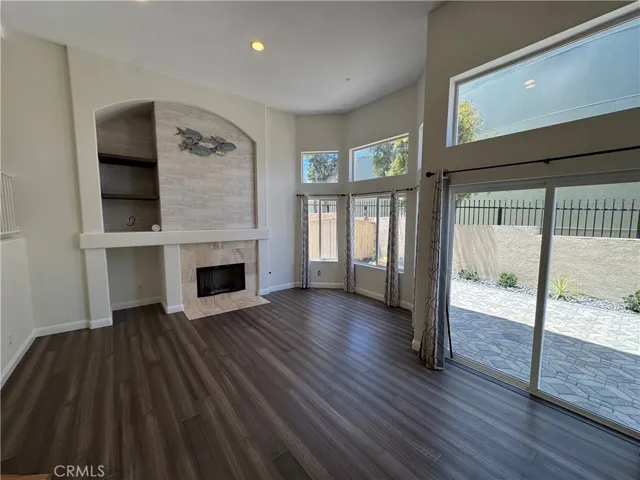 Living rooom with slider access to generous patio space