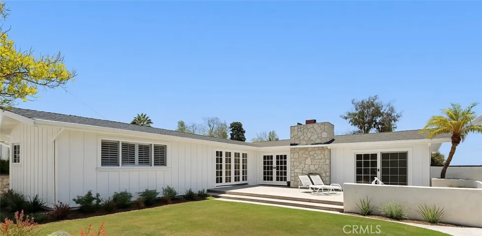 rendering with white board and batten siding and light landscaping