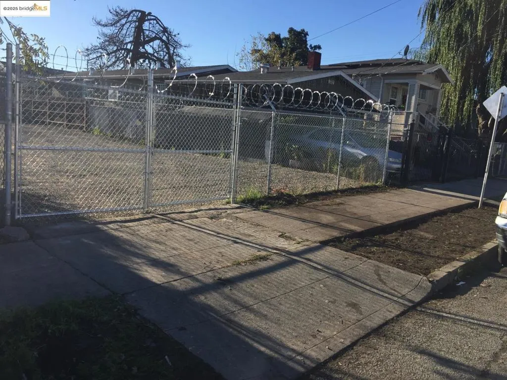 Back of house featuring a gate