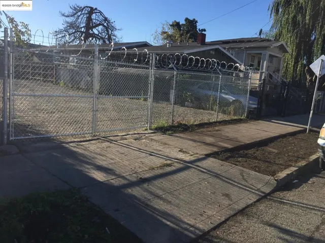 Back of house featuring a gate