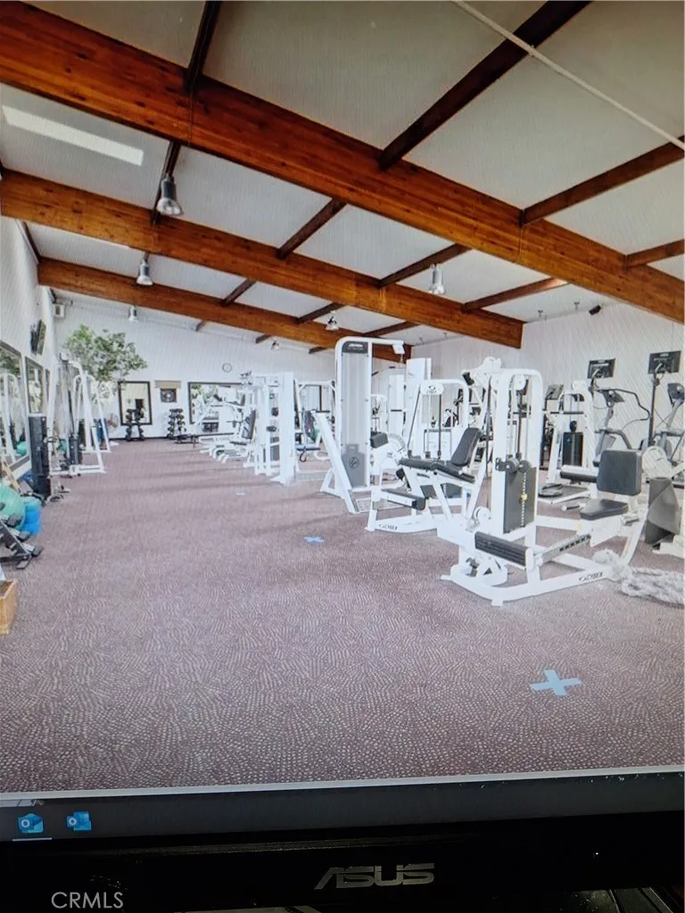 downstairs space when it was a private gym, notice tall ceilings