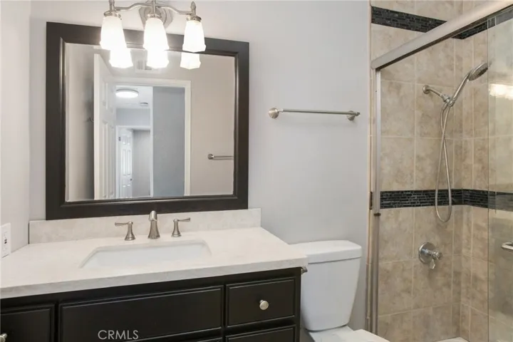 Guest bath with tile shower.
