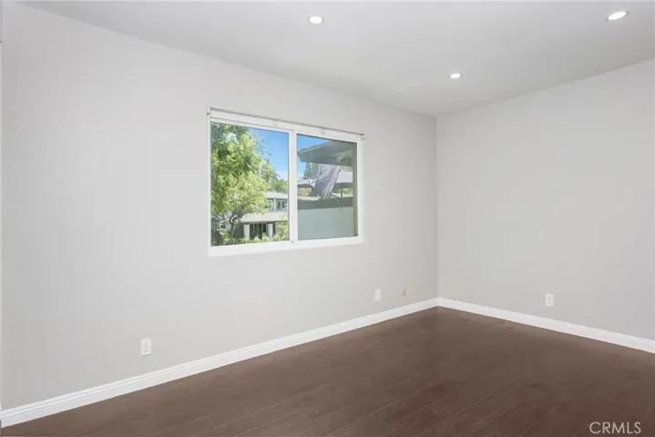 Second bedroom with can lights and built in closet.