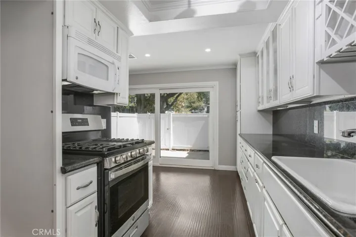 Chefs kitchen with granite and added storage & cabinets.