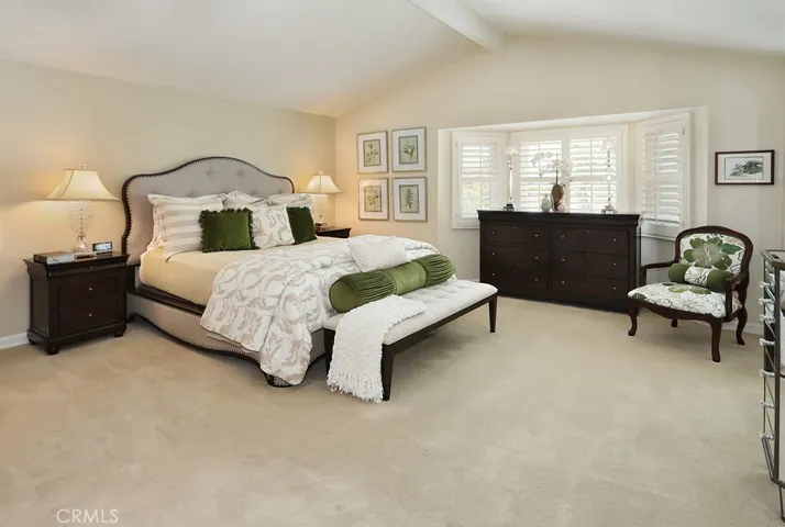 Primary suite with vaulted ceilings