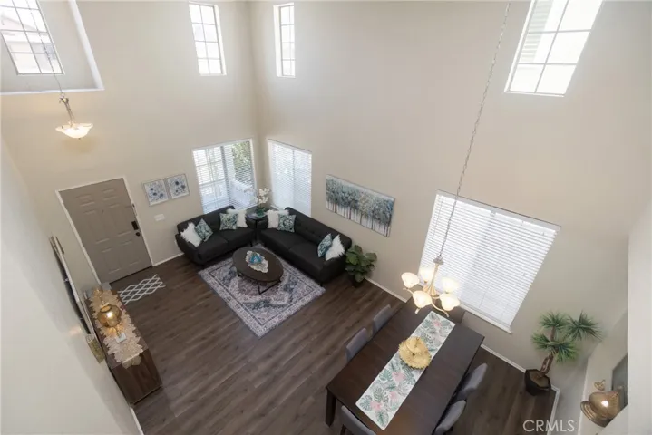 Open and airy with a dramatically high two-story ceiling over the formal living and dining area