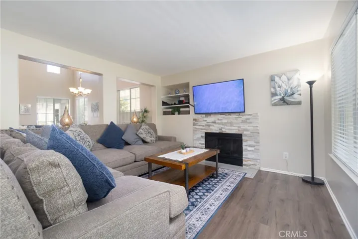 Enjoy the toasty fireplace with a stacked stone facade in the spacious family room