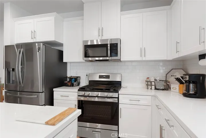 Very spacious kitchen with plenty of storage space and large island for casual dining. Appliances remain.