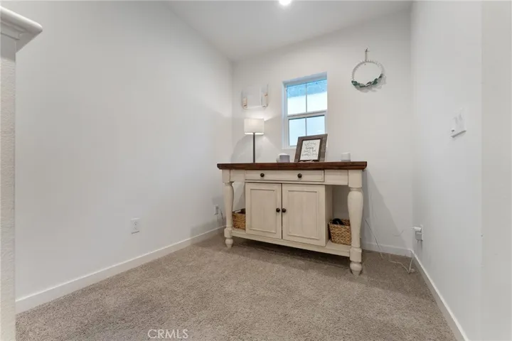 The top of the stairs has just enough space for placing a credenza or bench or desk or you decide.