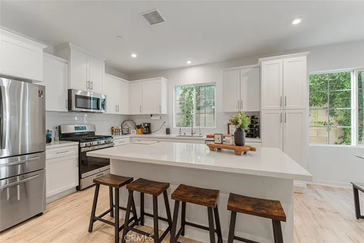 Very spacious kitchen with plenty of storage space and large island for casual dining. Appliances remain.