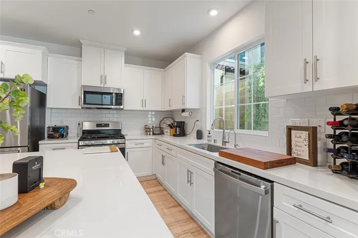 Very spacious kitchen with plenty of storage space and large island for casual dining. Appliances remain.
