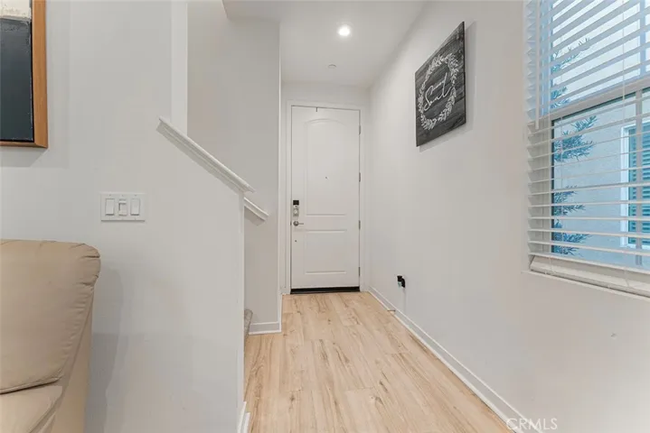 Entry with stairs perpendicular leading to the bedrooms/loft and 2 of the 3 bathrooms.