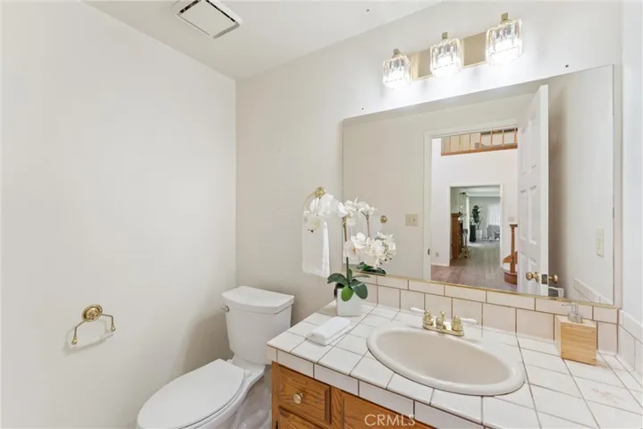 Powder room near sitting room and main entry