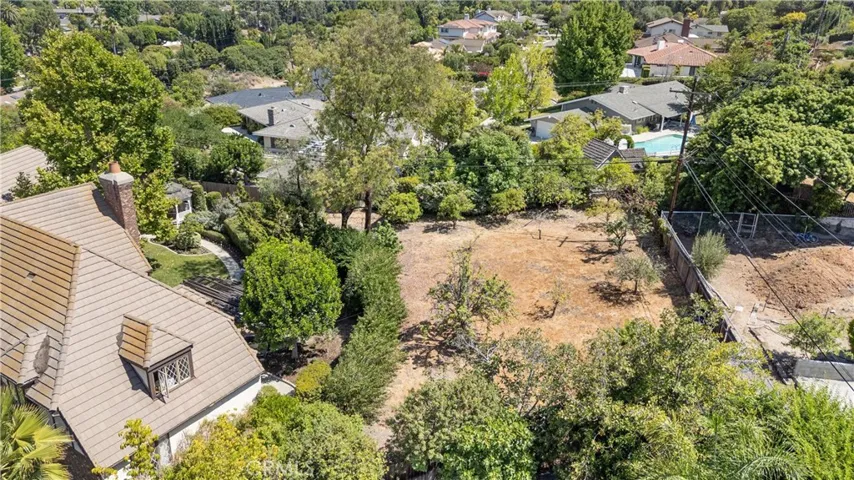 Aerial view of west side of house, backyard and lot