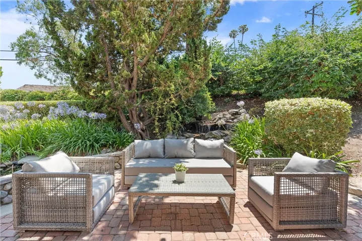 Seating area on Patio next to charming Koi pond