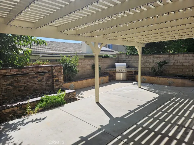 Backyard view of Patio & Block Wall