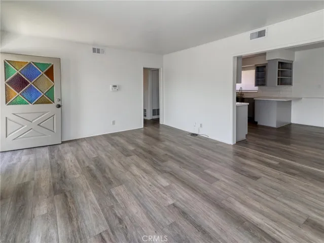 Living Room Leading to Dining and Kitchen