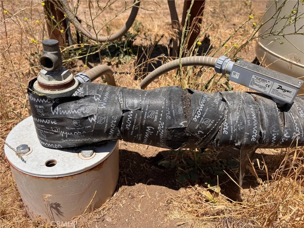 Water spout at well