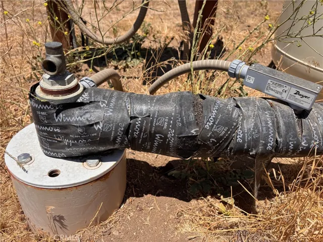 Water spout at well