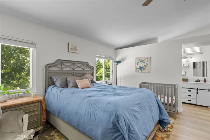 Spacious primary with double door entry, vaulted ceilings and ceiling fan