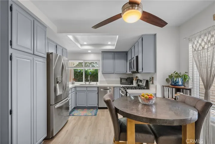 Awesome kitchen with sparkling quartz counters tops and stainless steel appliances and sink