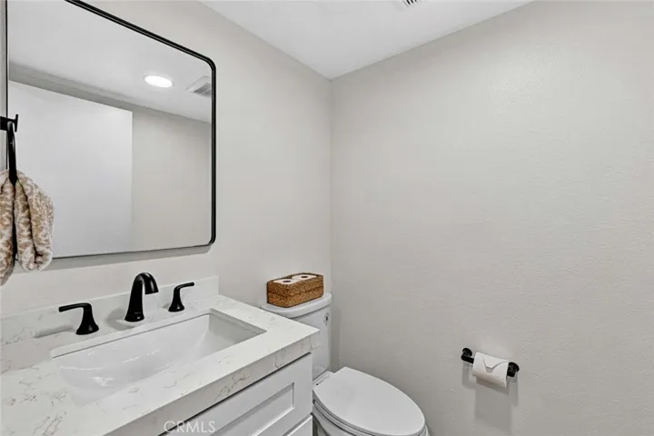 Bathroom located downstairs is completely remodeled.
