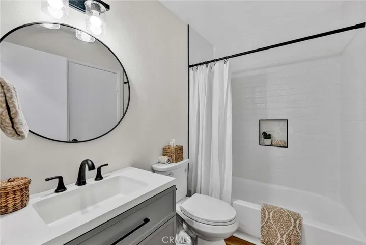 Bathroom located upstairs is completely remodeled.