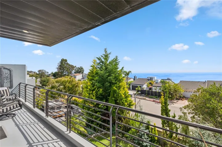 Private balcony off primary suite with ocean view