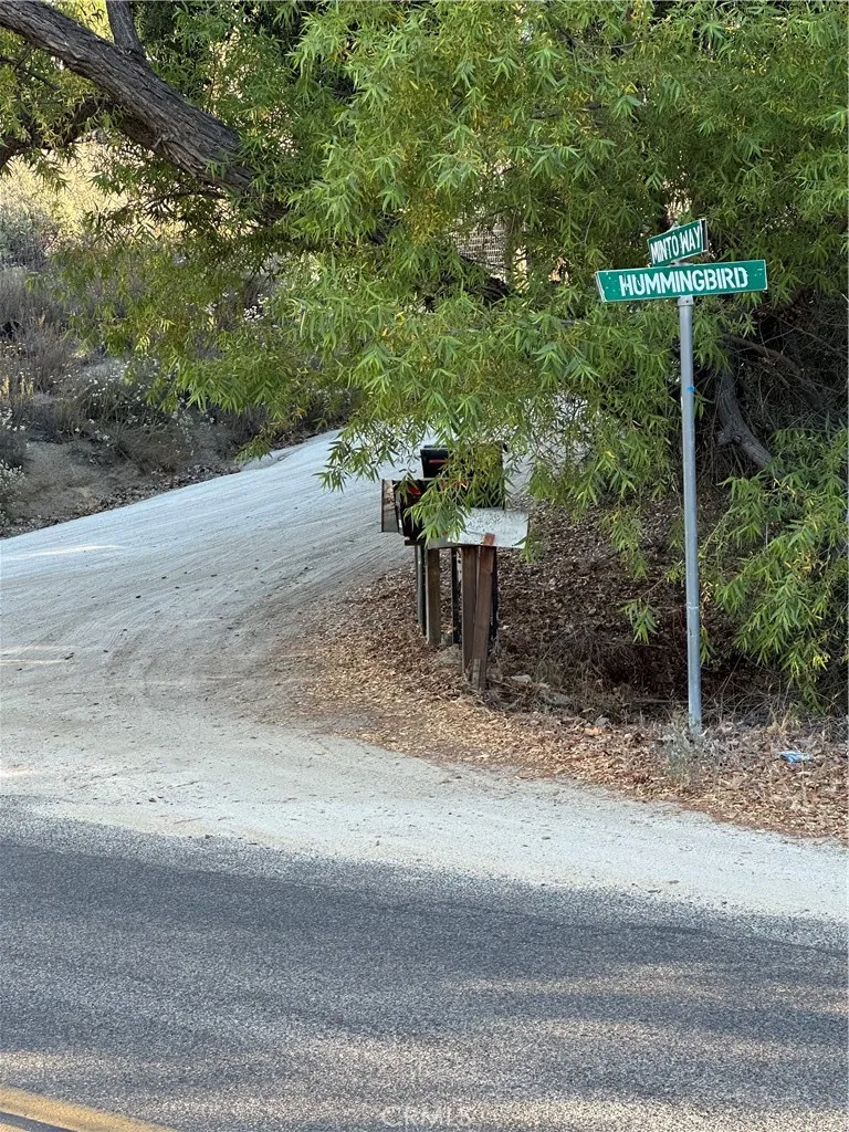 Hummingbird Lane Street Sign on other side of Minto Way from the entrance to the property.