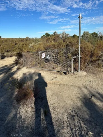 Gate by entrance to the parcel.