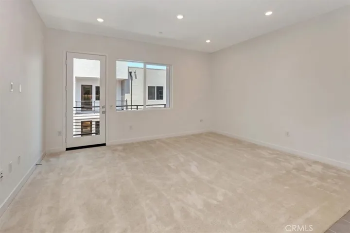 Balcony outside living space - hot water heater is out on balcony behind closet door