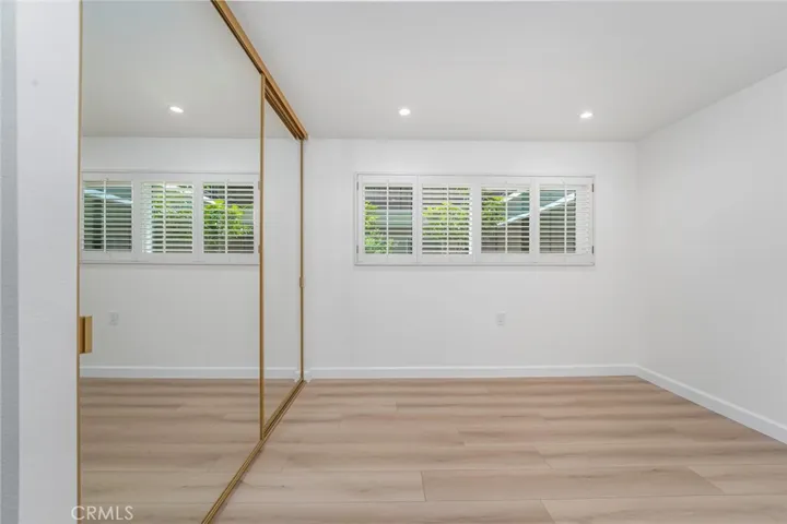 Guest room offers plantation shutters for privacy