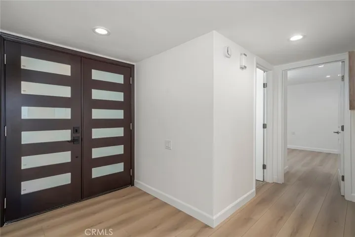 Custom double entry doors with beveled frosted glass for privacy