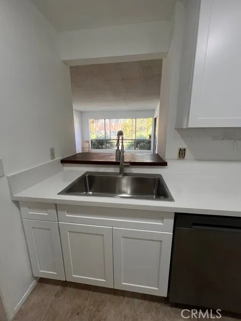 Kitchen facing the living room windows.