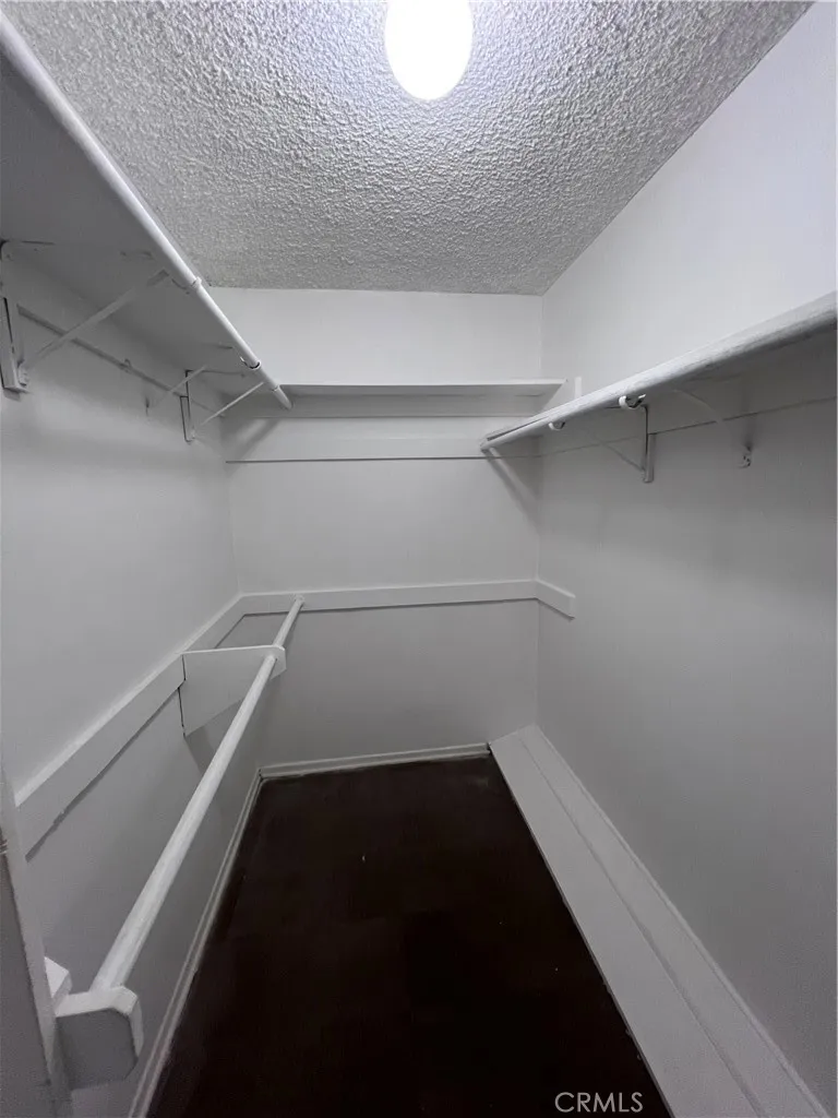 Primary bedroom walk-in closet