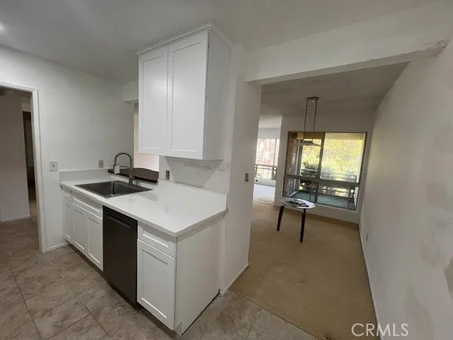 New kitchen cabinets and stainless steel dishwasher.  Great light throughout!