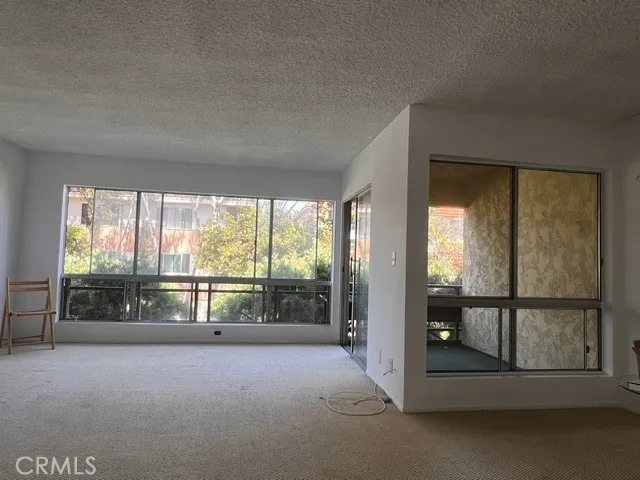 Living room and patio facing a quiet street.