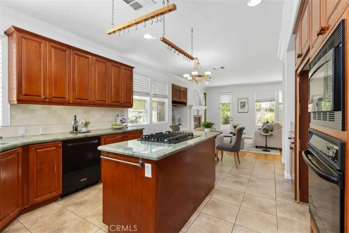 Island has gas cooktop with auto vent