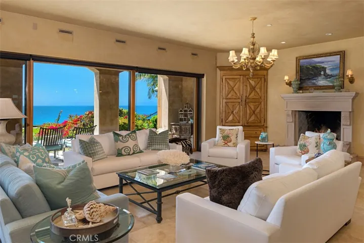 Warm, cozy room with fireplace.  Large sliding doors open on both sides.