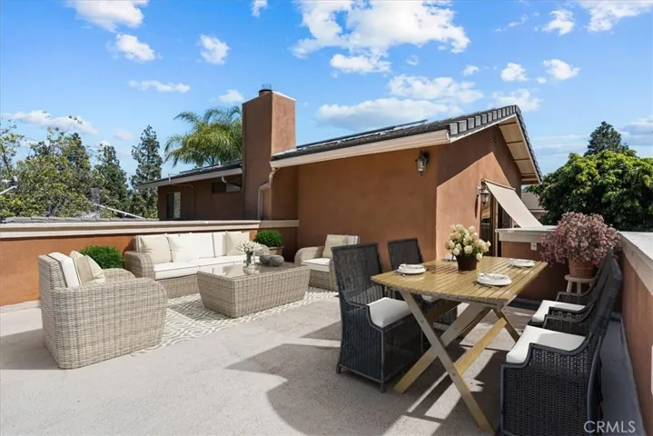 Virtually Staged to show size of private terrace off primary suite