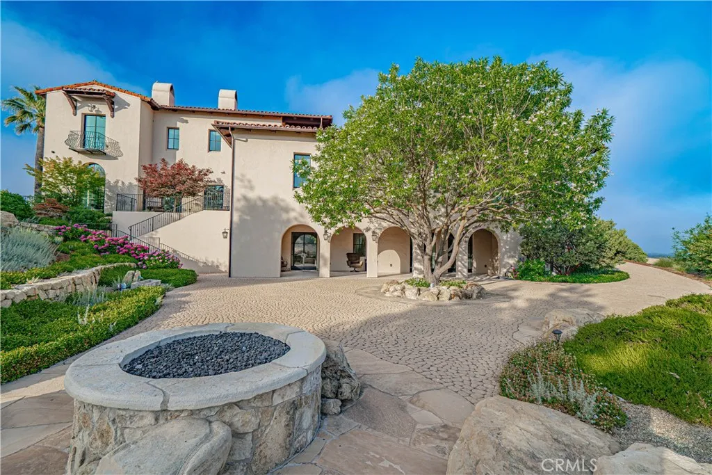 Yet another fantastic entertaining space is found on the lower grounds, featuring an inviting outdoor fire pit.