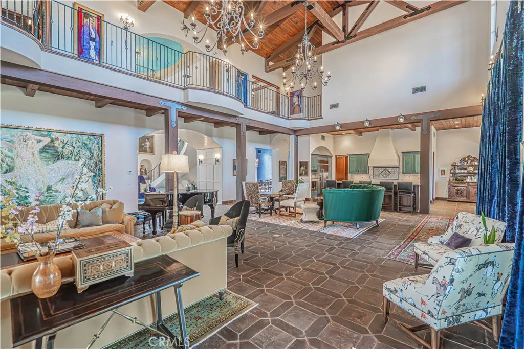 Imported Spanish tiles flow throughout the home, while custom designer wrought iron railings on the upper landing create a striking focal point and enhance the open-concept design between the first and second floors.